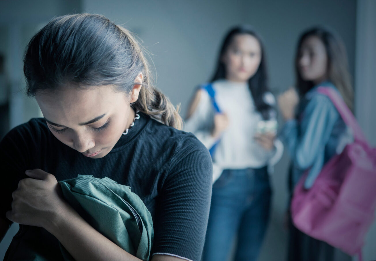 Picture,Of,Depressed,Teenage,Girl,Bullied,With,Her,Friends,In