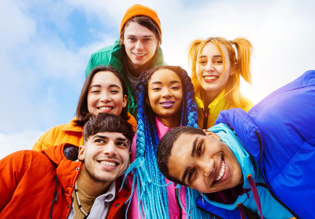 Multiracial,Group,Of,Young,Happy,Friends,Meeting,Outdoors,In,Winter,