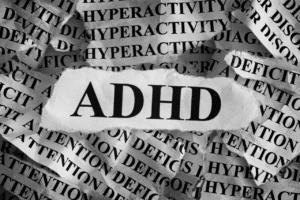 adhd letters over a pile of paper.