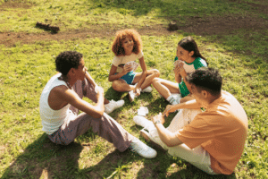 teenagers sitting outside discussing Are Teen Curfews Good For Mental Health?