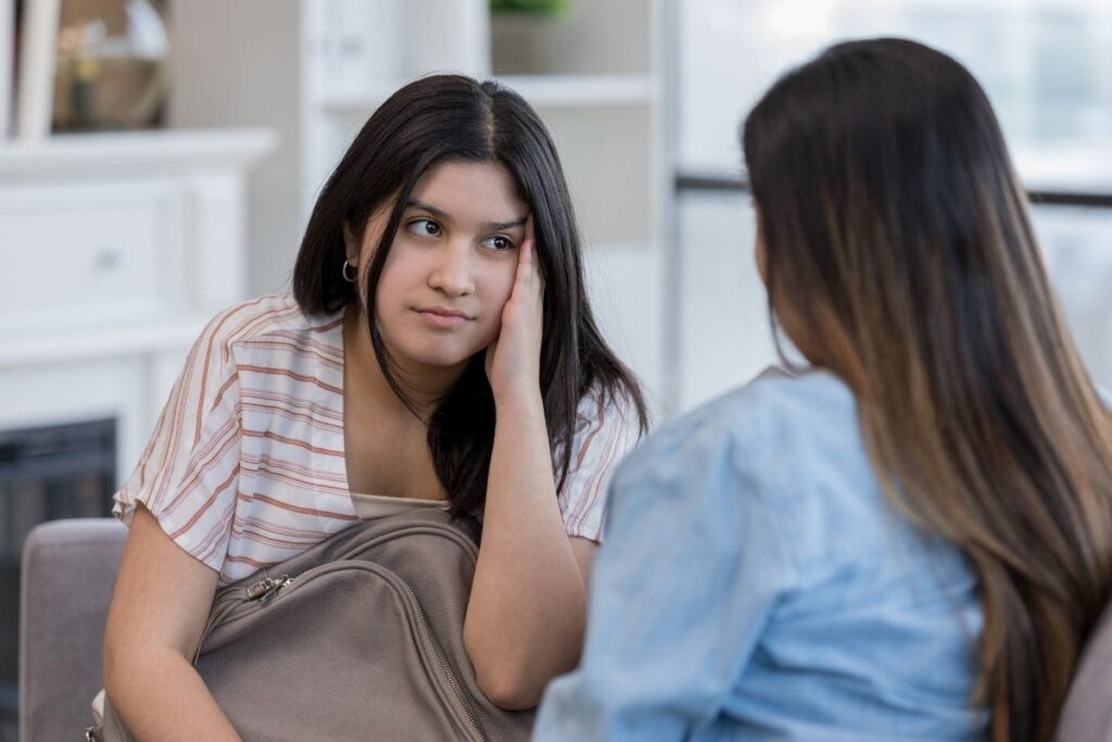 teen talking to parent about going to residential rehab